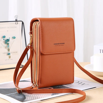 Multifunctional shoulder bag with touchscreen phone compartment